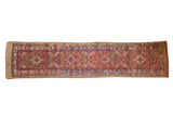 Antique Serab camel hair runner with an allover henna plant design in red, sky blue, and saffron yellow.