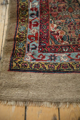 Corner close-up of an antique Serab runner's authentic camel hair border and intricate inner guards.