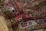 Textured pile and knot heads of an antique camel hair Serab rug's geometric border.