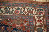 Antique Bijar rug corner, intricate Herati borders with indigo, cherry red, and ivory motifs.