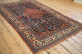 Original reddish side cord selvage and intricate ivory border of an Antique Bijar rug.