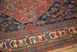 Antique Bijar rug border detail, featuring ivory, indigo, and cherry red stylized floral designs.
