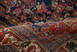 Intricate hand-knotted pile texture of antique Bijar rug, featuring indigo, cherry red, and ivory.