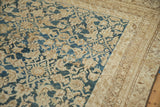 Distressed teal Herati design, textured beige field, and patterned border of antique Malayer.