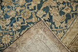 Antique distressed Malayer carpet with hand-knotted foundation, intact selvage, and worn Herati pattern.