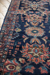 Lustrous wool pile and floral palmettes in rose and teal on a vintage Persian Lilihan runner.