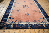 Antique Chinese Peking rug border: navy blue, ivory, pale copper floral and bird motifs.