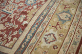 Antique Mahal carpet: black cherry red field displaying floral motifs, adjacent to a beige, blue, gold band.