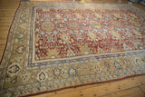 Corner of antique Mahal carpet, intricate borders with beige, gold, blue, and mauve motifs.