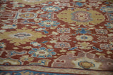 Angled close-up of the mostly even pile of an antique Mahal carpet showing floral medallions.