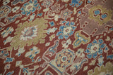 Angled close-up of the antique Mahal carpet's hand-knotted pile and its intricate floral design.