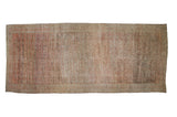 Antique distressed Fereghan carpet with an allover Herati design in abashed ruby red, navy blue, and ivory tones.