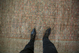 Even wear across the knot heads reveals the textured foundation of this antique distressed Fereghan carpet.