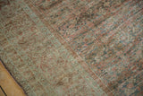 Detailed texture of a distressed Fereghan carpet showing even wear down to the knot heads.