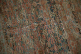 Detailed texture of a distressed antique Fereghan carpet showing even wear and visible knot heads.