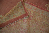 Fine hand-knotted weave and intact side cord selvage on the back of a vintage Oushak carpet.