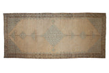 Antique distressed Malayer runner with a blue diamond medallion on a camel field, 7x16.