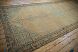 Antique distressed Malayer carpet viewed down its length, highlighting the geometric pattern in camel and dusty blue.