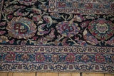 Close-up of lotus flower and cloudband motifs on an antique Persian Meshed carpet.