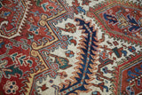 Close-up of the even pile on a vintage Heriz showing serrated leaf and palmette motifs.