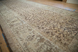 Worn coffee brown shrub motif on sand, showing foundation of distressed Mahal rug.