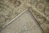 Distressed Mahal carpet corner revealing worn pile, hand-knotted foundation, and light fringe.