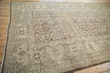 Distressed coffee brown shrub and henna plant design with visible foundation on vintage Mahal carpet.