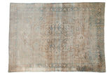 Antique distressed Kerman carpet with a central starburst medallion in pale coffee brown and dusty sky blue.