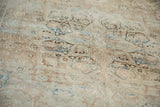 Soft, blanket-like texture of a distressed Kerman carpet showing areas worn to the foundation.