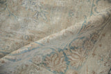 Soft, blanket-like wool and pliable foundation of a distressed antique Kerman carpet.