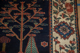 Vintage Baktiari runner: navy tree of life, madder red, celadon green, beige floral border.