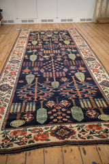 Traditional Baktiari runner featuring Garden of Paradise motif in rich navy, red, and celadon.