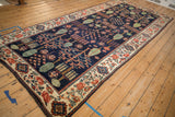 Navy Baktiari field with green cypress and red tree-of-life motifs, beige floral border.