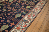 Traditional Baktiari runner: navy Garden of Paradise field and contrasting red floral border.