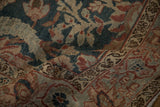 Detail of the Samovar Turtle border and distressed low pile on a vintage Tabriz rug.