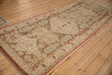 Decorative geometric patterns and heavy abrashes on the distressed Caucasian rug runner.