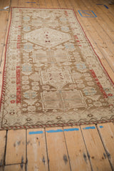 Antique Distressed Caucasian runner detail: geometric medallion, finned leaves, powder blue, coffee brown abrashes.