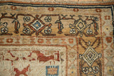 Close-up of vintage Bibikabad rug's fine weave, with copper, sky blue, and beige blossoms.
