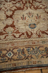 Fine weave detail of vintage Bibikabad rug, featuring copper blossoms and a geometric border.