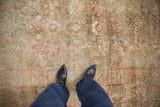 Soft, even-worn pile of distressed antique Kerman rug, with terracotta and sage palmettes.