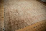 Distressed antique Kerman carpet border, with Safavid-style floral palmettes in faded terracotta and ivory.