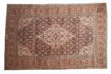 Vintage Tabriz carpet with a diamond medallion and oversized Herati design in ivory, silver, and raspberry tones.