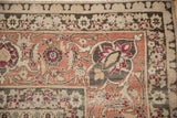 Weaver's inscription on the Herati border of a vintage Tabriz in raspberry, silver, and ivory.