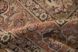 A fold in a vintage Tabriz carpet highlights the low, even pile and Herati design.