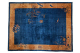 Antique Peking carpet with an open sapphire blue field, gold border, and pictorial lantern and bat motifs.