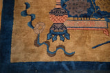 Hand-knotted lantern motif in dusty rose and blue on the antique Peking carpet's gold pile.
