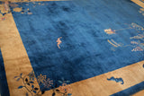 Antique Peking carpet showing pictorial bat and lantern motifs on its rich sapphire blue field.