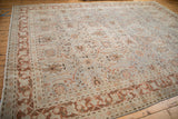 Distressed Tabriz carpet corner, with tattered edge and pale copper, dusty blue floral border.