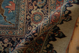 Dense hand-knotted pile and dragon-style arabesques on an antique Halvaie Bijar Persian carpet.