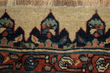 Thick wool fringe and a navy blue border motif on an antique Persian Halvaie Bijar carpet.